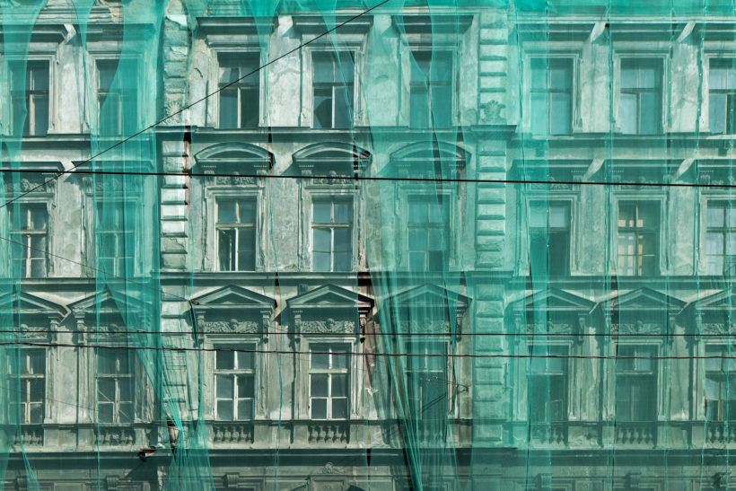 Prague facade under green net